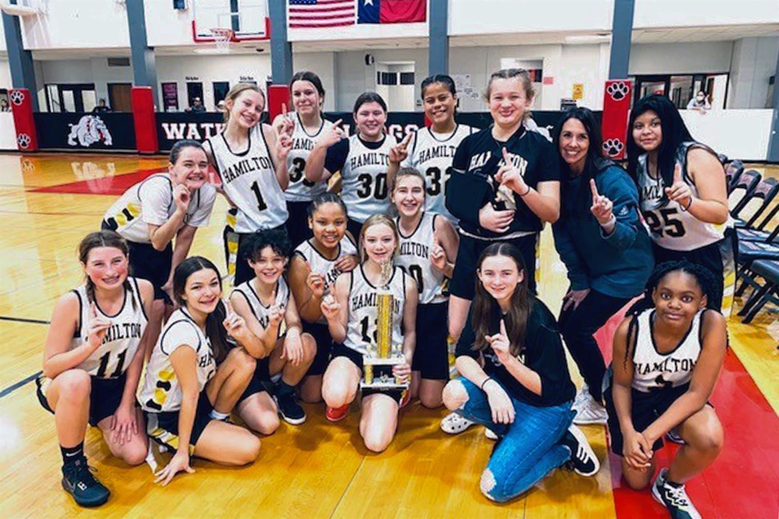 The Hamilton Tigers’ seventh grade B team won the East Division girls’ basketball crown with an 6-0 record.